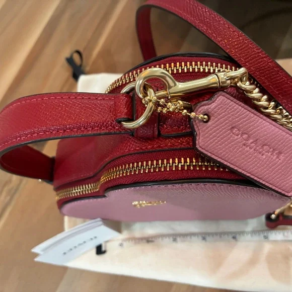 Coach Pink Heart-Shaped Crossbody Bag with Gold Accents. Beautiful timeless shap - Picture 4 of 6